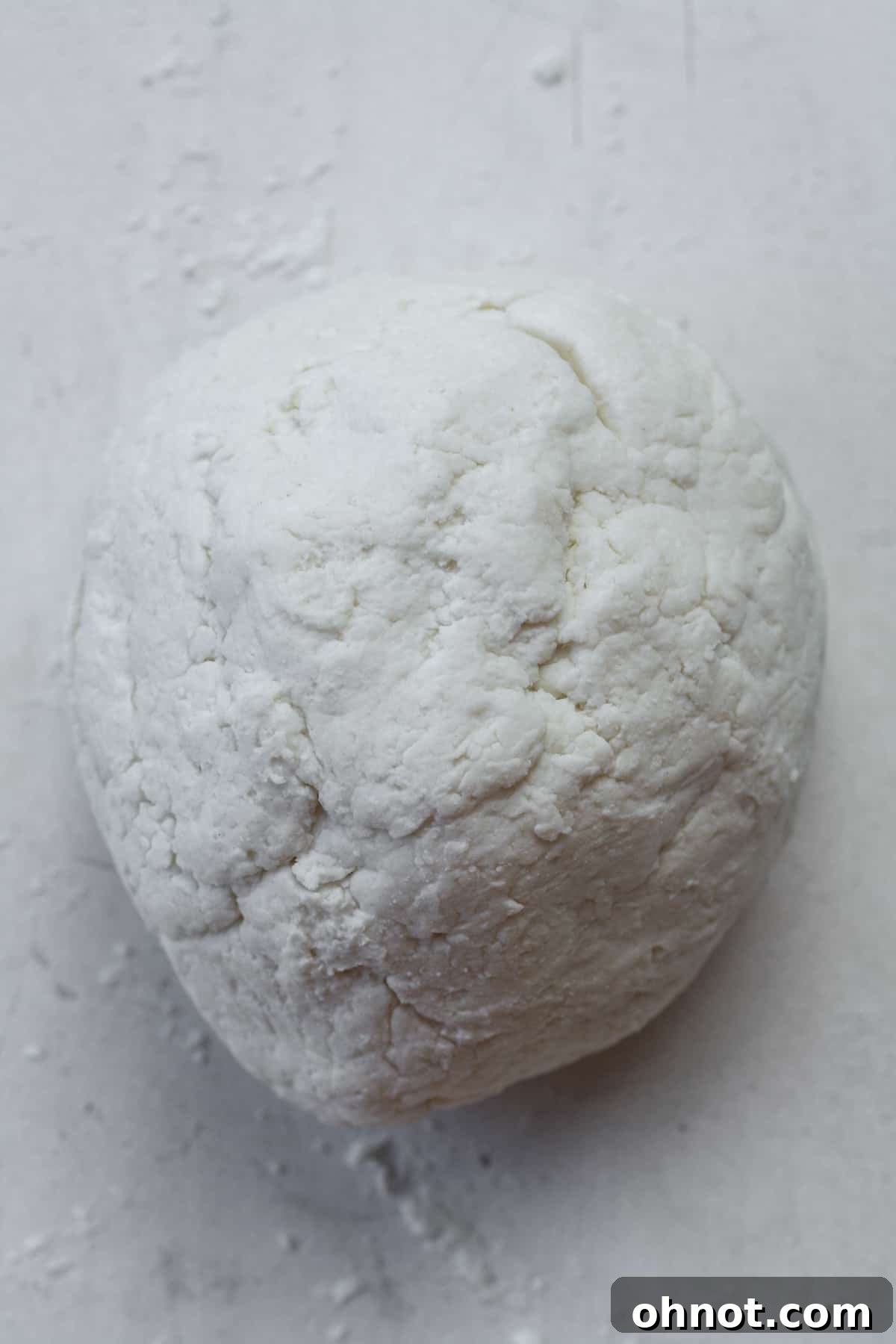 The bagel dough rolled into a smooth ball.