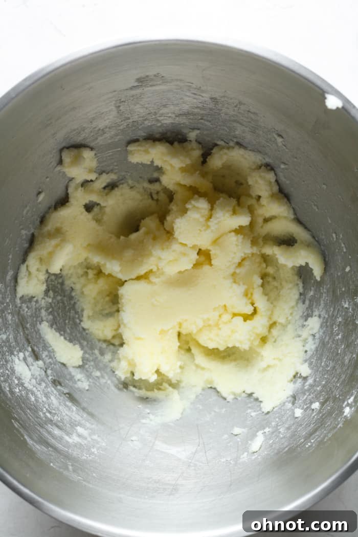 Creamed butter and granulated sugar, light and fluffy, in a mixing bowl.