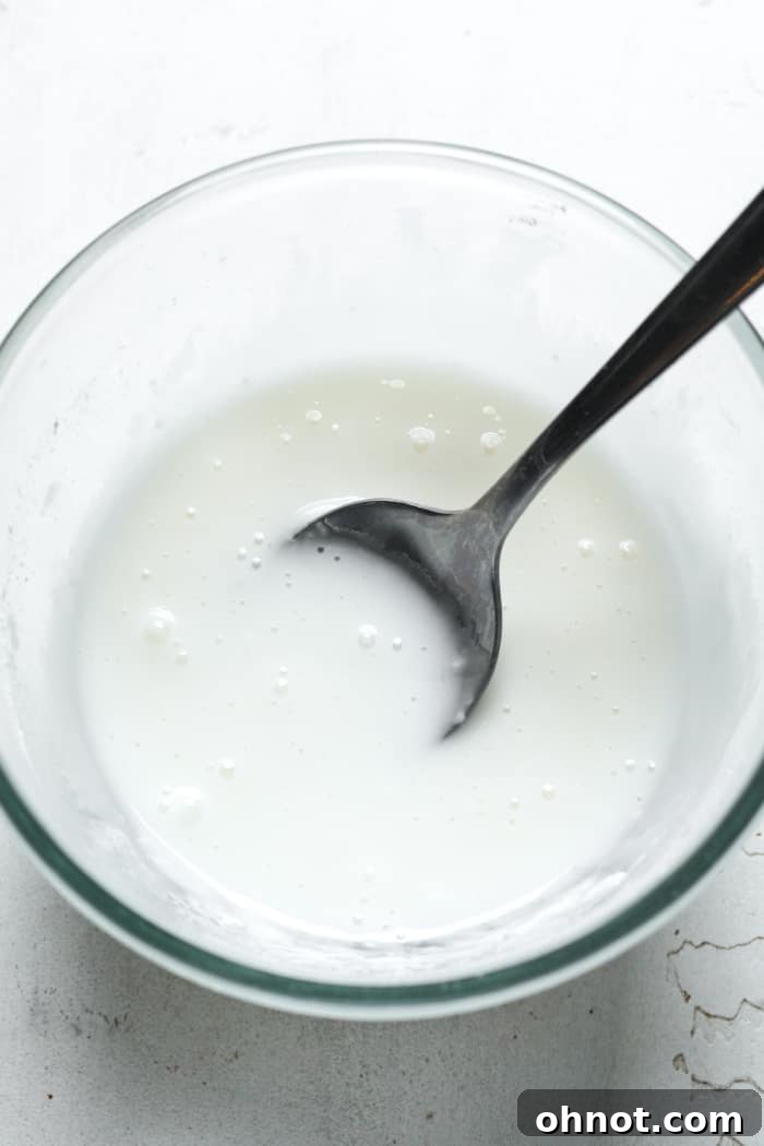 Smooth vegan icing in a bowl, ready for decorating cookies.