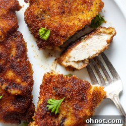 A freshly made chicken schnitzel, golden and crispy.