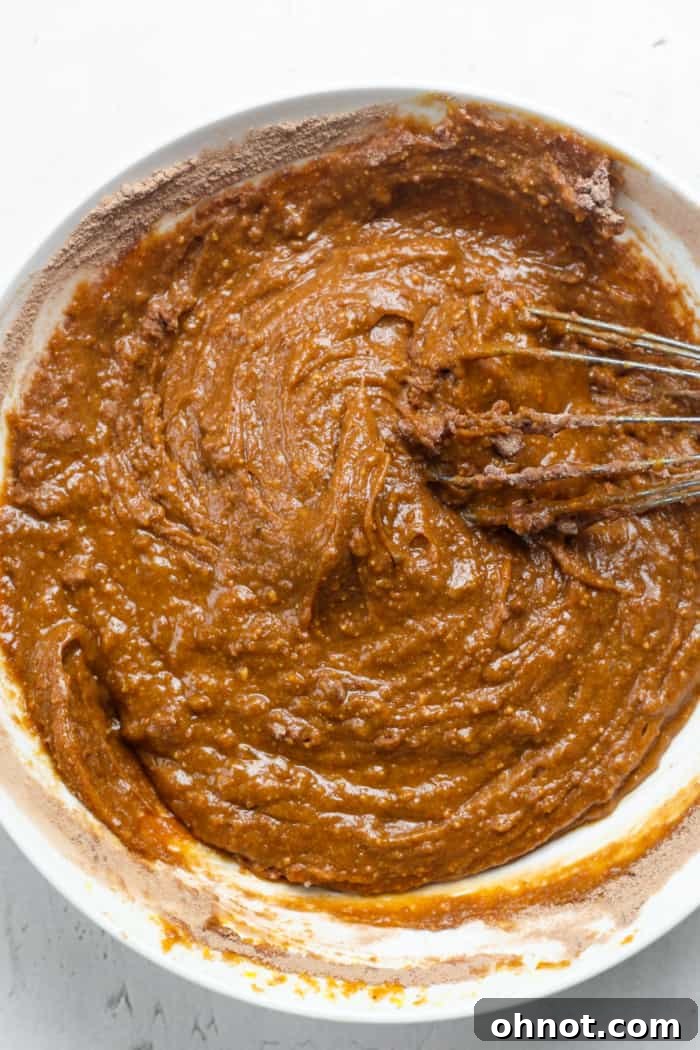Thick protein brownie batter, after adding protein powder and baking powder.
