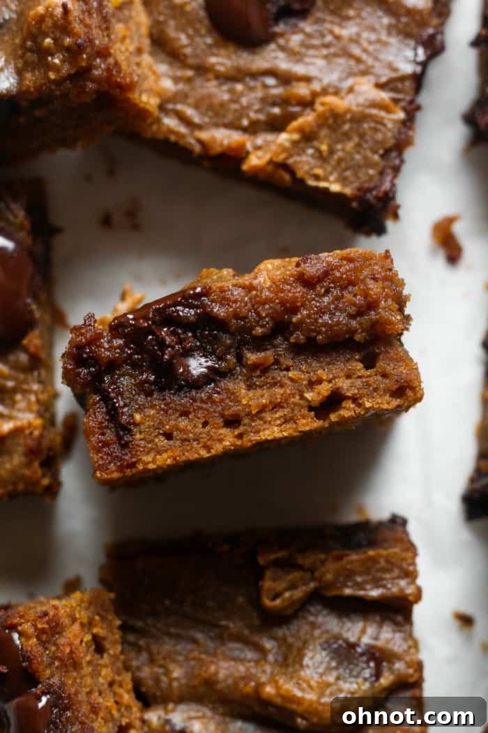 A close-up of a gooey high protein brownie, showing its rich texture.