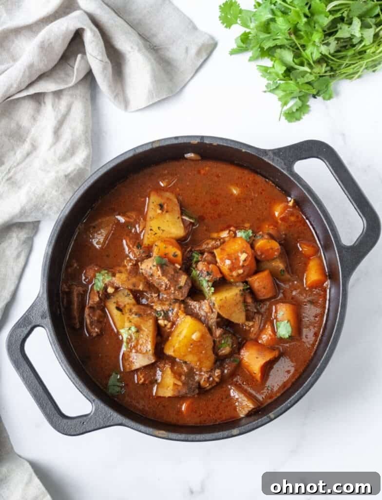 Whole30 beef stew simmering in an Instant Pot.