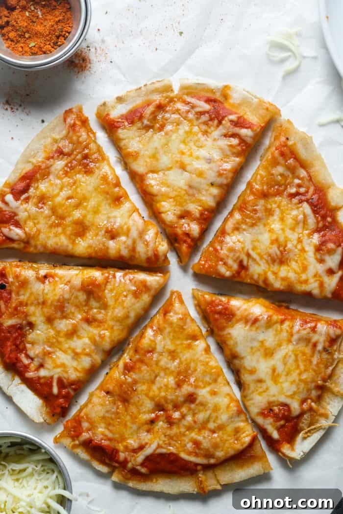 Sourdough pizza crust fresh from the oven, showcasing its golden-brown, bubbly texture and classic pizza toppings.