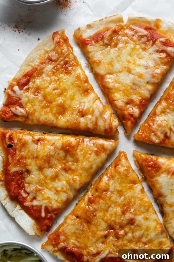 Individual slices of gluten-free sourdough pizza arranged neatly, highlighting the texture of the crust and appealing toppings.