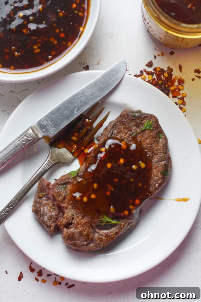 Perfectly grilled steak generously coated with homemade Korean BBQ sauce, garnished with sesame seeds.