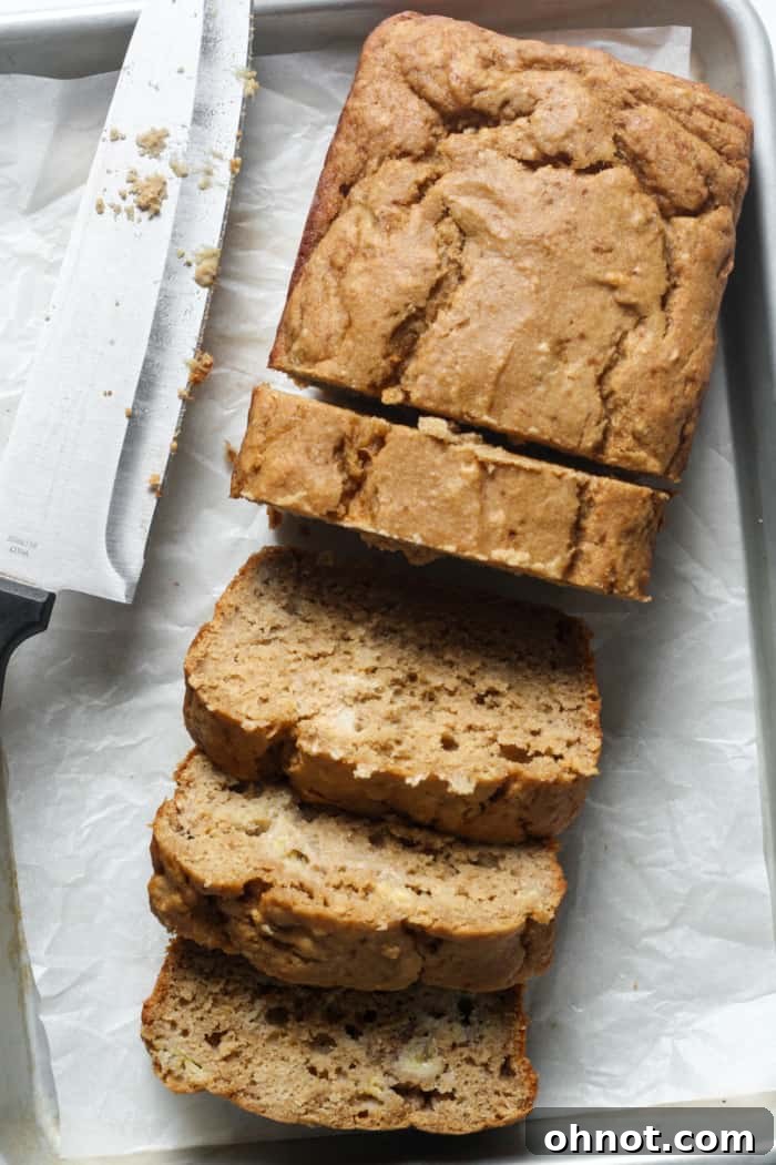 Sourdough banana bread, sliced on a wooden board.