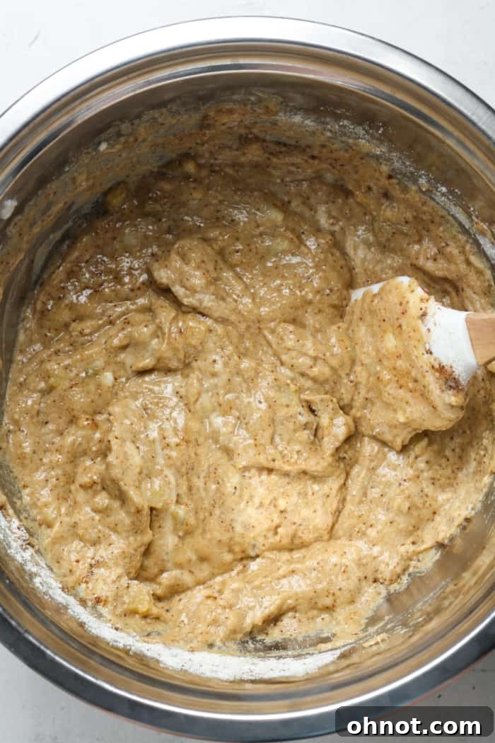 Sourdough banana bread batter in a mixing bowl.
