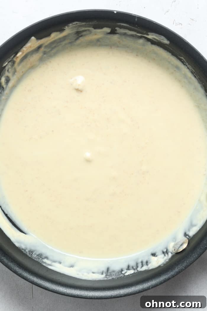 A bowl of perfectly melted white chocolate, smooth and ready for coloring.