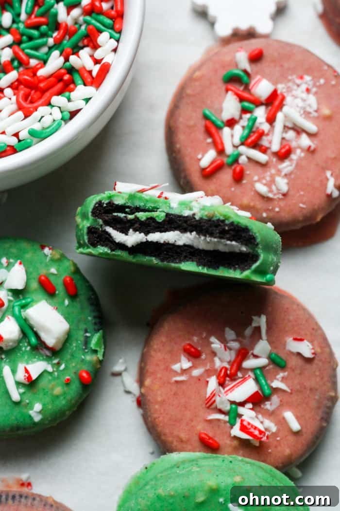 A close-up shot of a Christmas Oreo with a bite taken out, showing the layers.