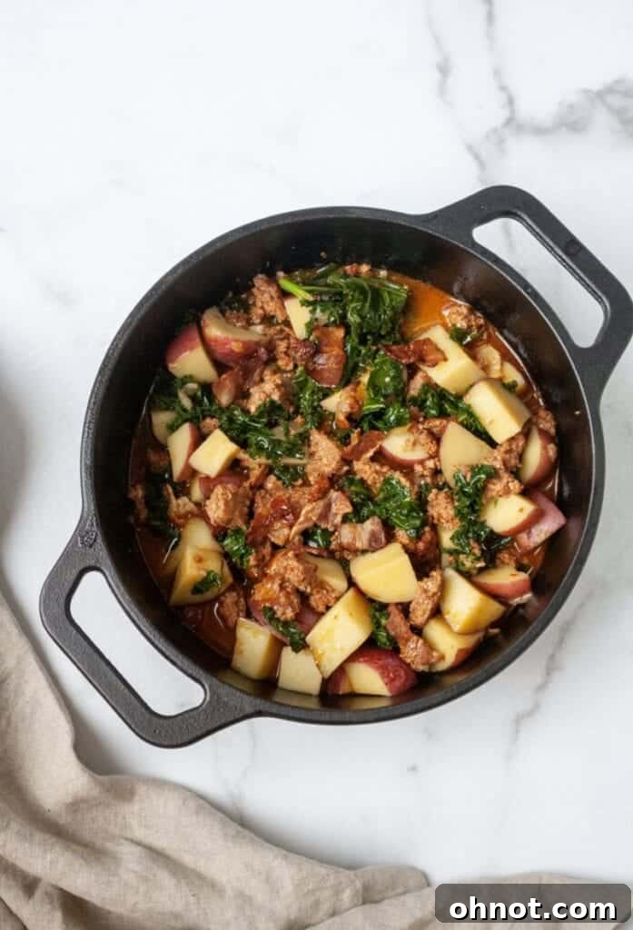Healthy Tuscan soup in a large pot, ready for serving.