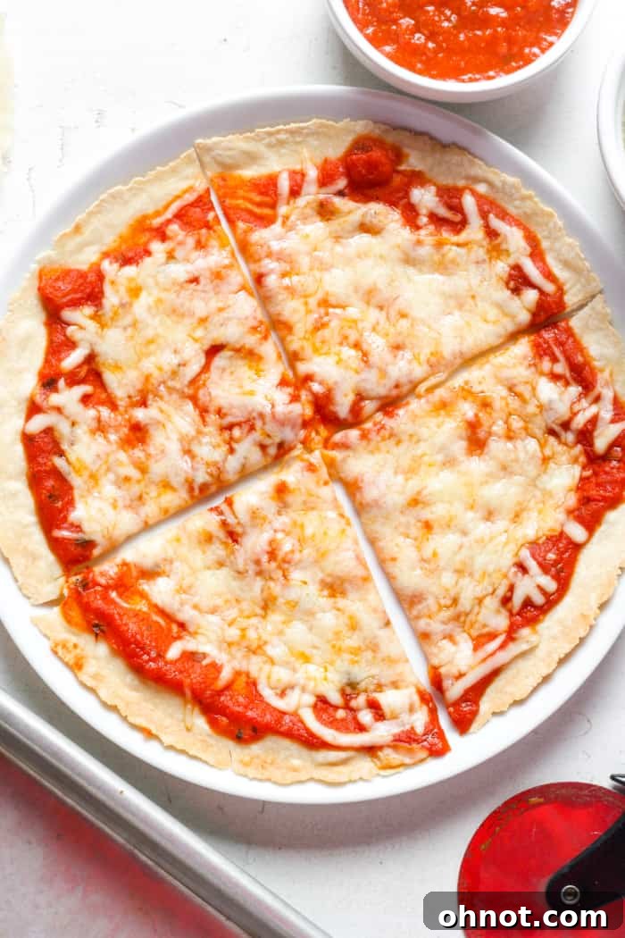 A beautifully plated tortilla pizza slice on a white plate, garnished with fresh herbs.