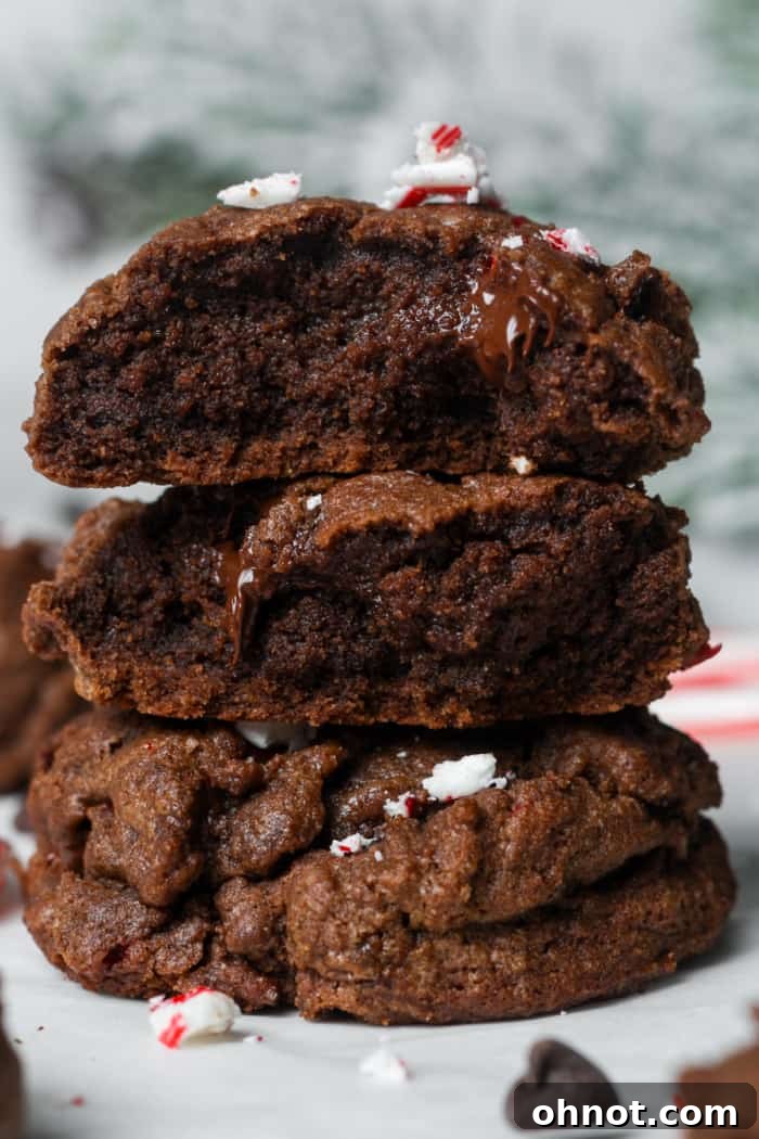 A stack of perfectly baked peppermint chocolate cookies, showing their thick, chewy texture.