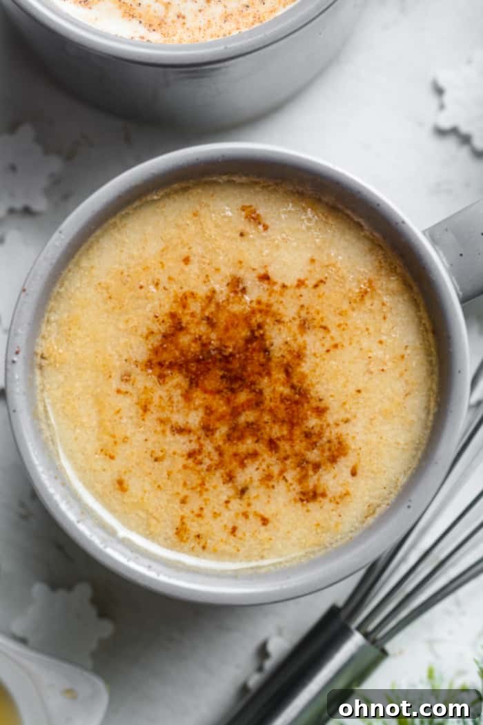 A beautifully presented glass of homemade vegan eggnog, ready to be enjoyed.