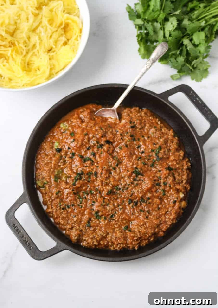 Close-up of baked spaghetti squash strands ready to be served, showing its pasta-like texture.