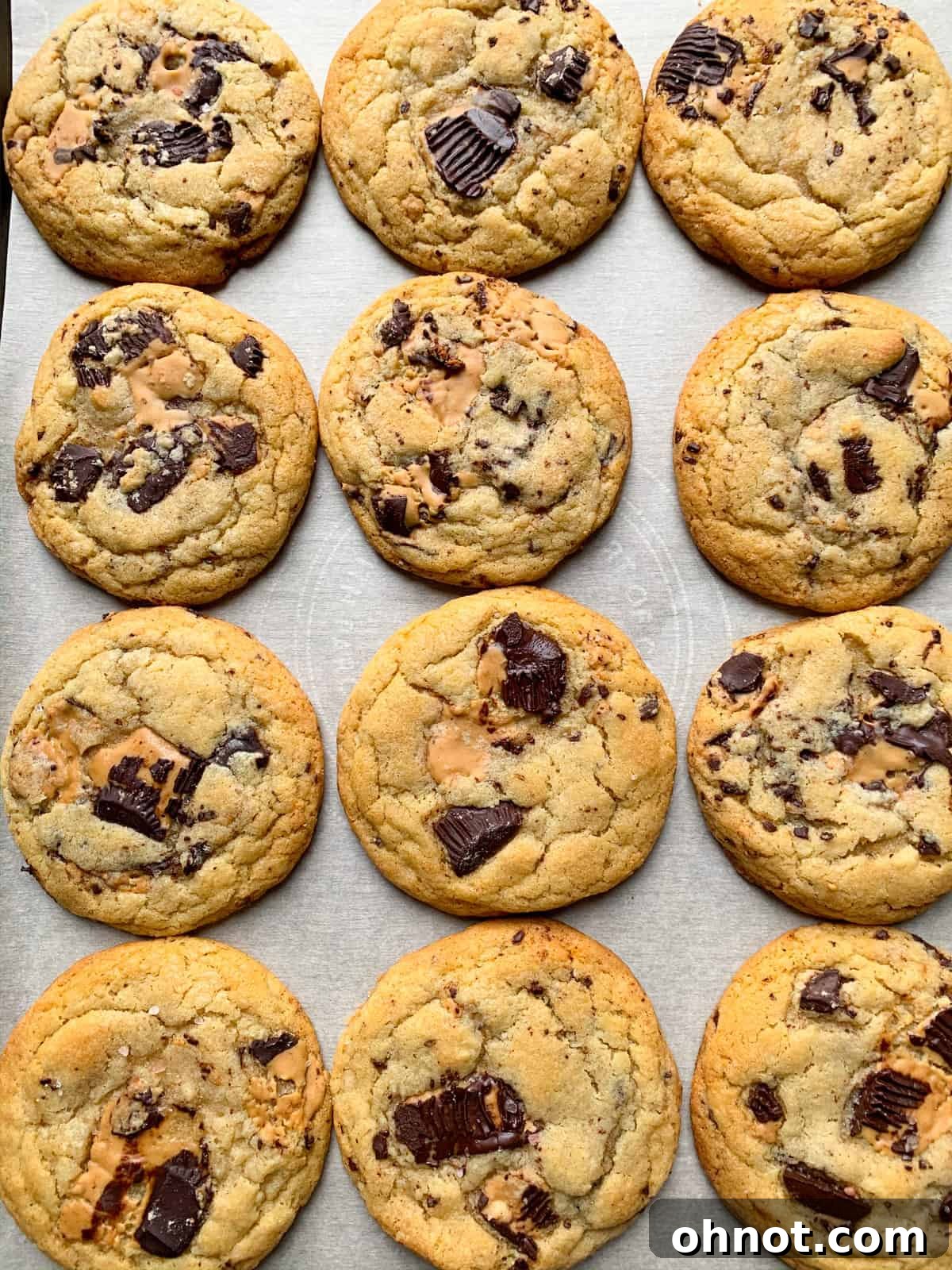 Delicious Grain-Free Chocolate Almond Butter Cup Cookies, fresh out of the oven with gooey centers.