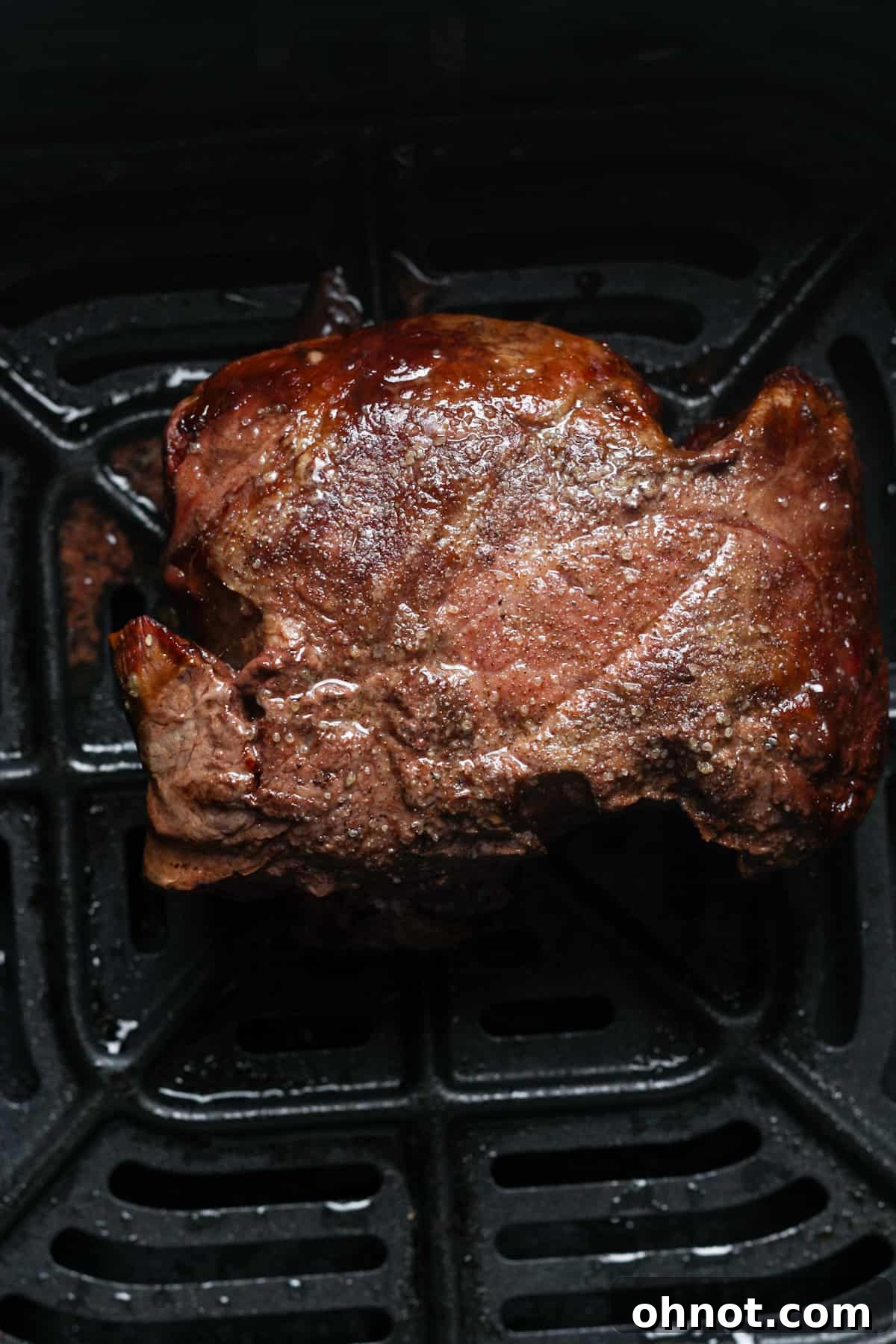 A perfectly air-fried steak on a plate.