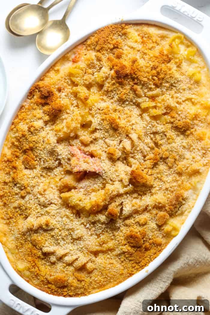 A freshly baked dish of seafood mac and cheese, bubbly and golden brown from the oven.