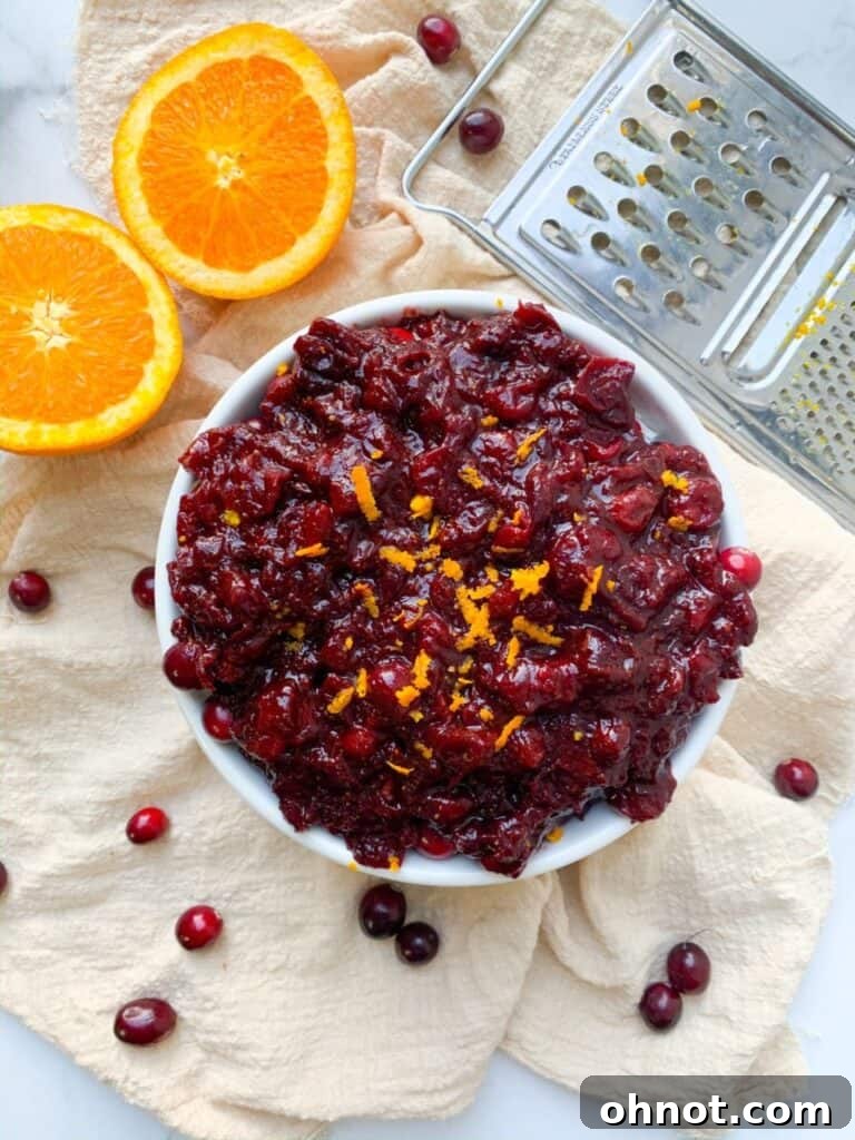 Close-up shot of Whole30 cranberry sauce in a white bowl, showing its rich texture and color