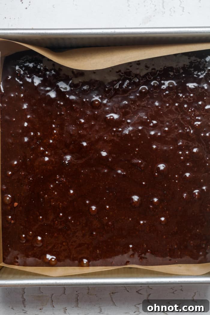 Baking pan filled with healthy chocolate brownie batter.