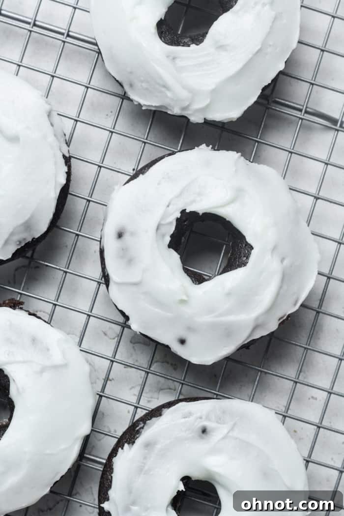Delicious vanilla glazed donuts, elegantly topped with crushed Oreo cookies.