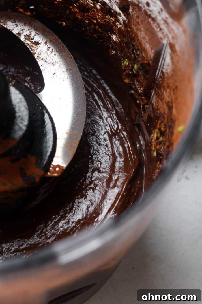 Chocolate pudding blending in a blender.