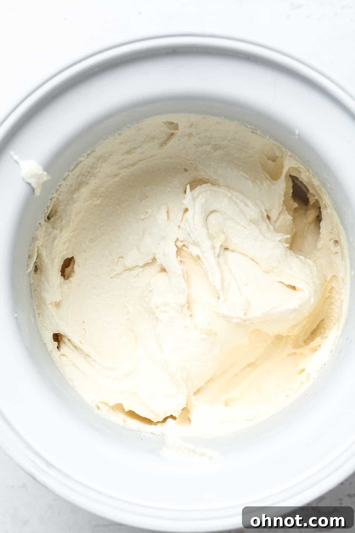 Soft-serve vanilla ice cream texture just out of the maker.