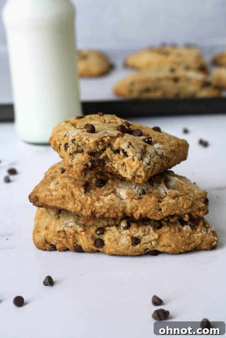 A stack of three grain-free chocolate chip scones, showcasing their beautiful texture and golden tops.