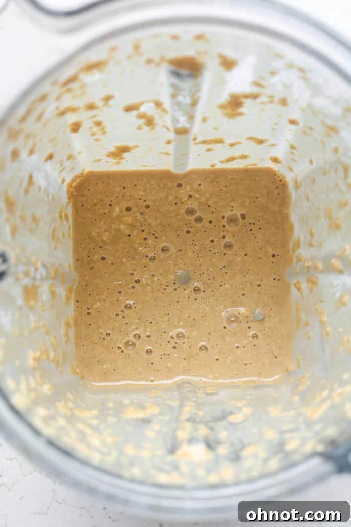 Blended oats in a Vitamix blender, smooth consistency.
