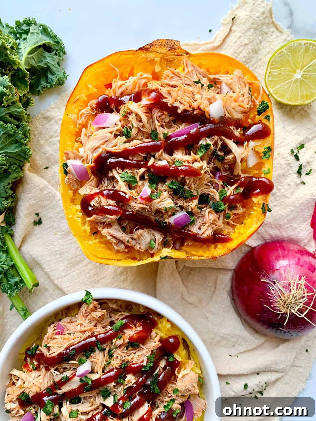 Delicious BBQ Chicken Spaghetti Squash with red onion garnish, perfect for Whole30 and healthy eating.
