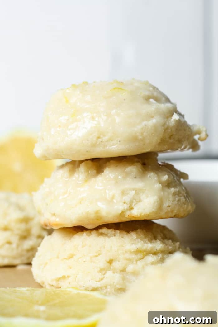 Soft, thick, and fresh lemon ricotta cookies with a bright yellow lemon glaze.
