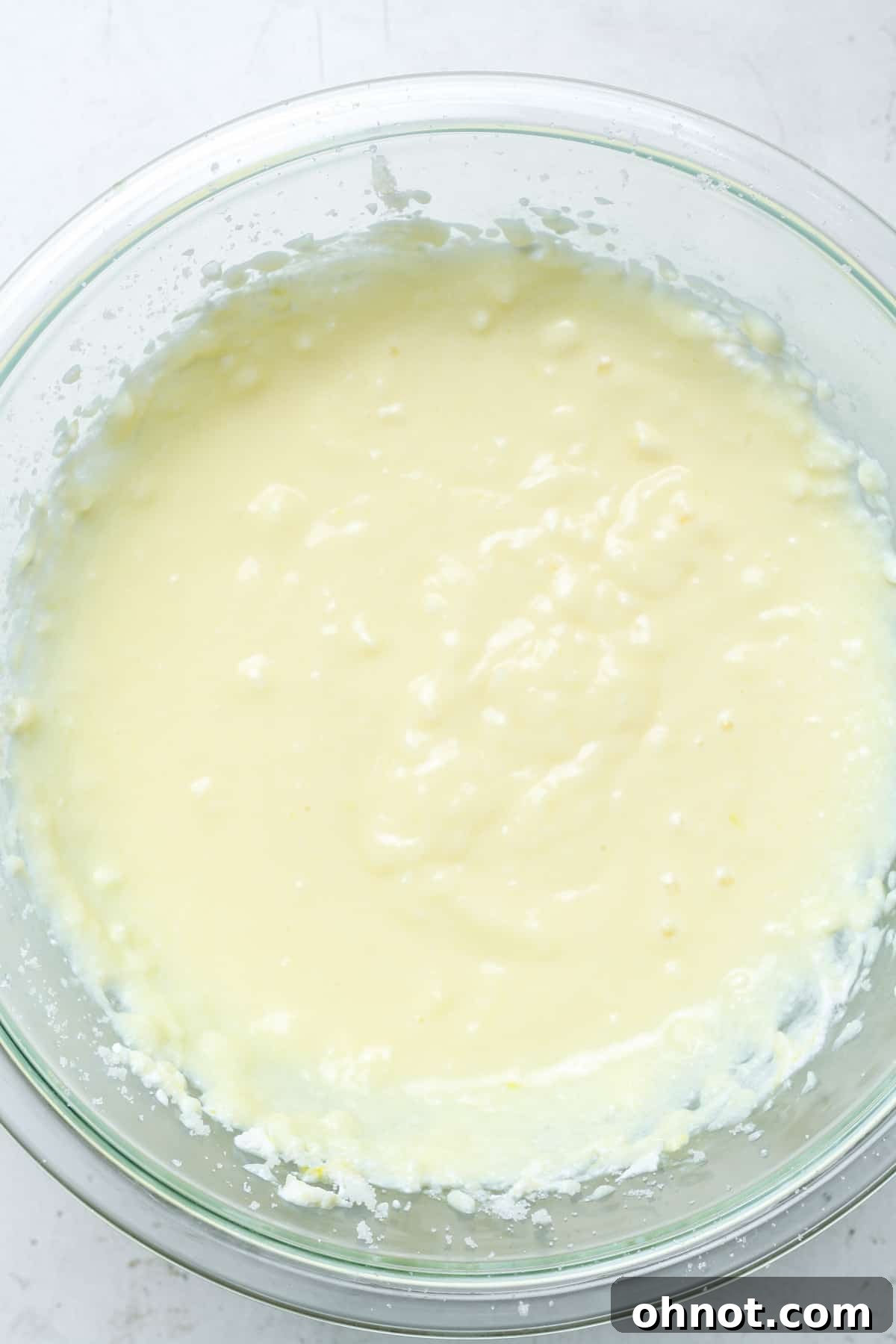 Light yellow batter after all wet ingredients are mixed.