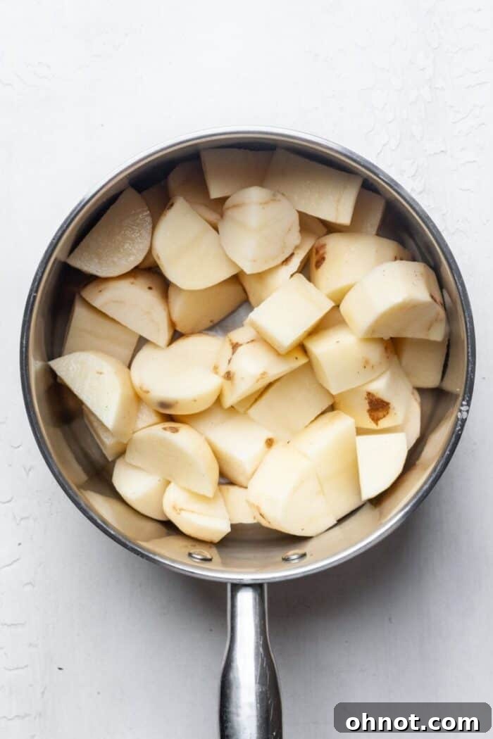 Uniformly cubed potatoes in a large cooking pot