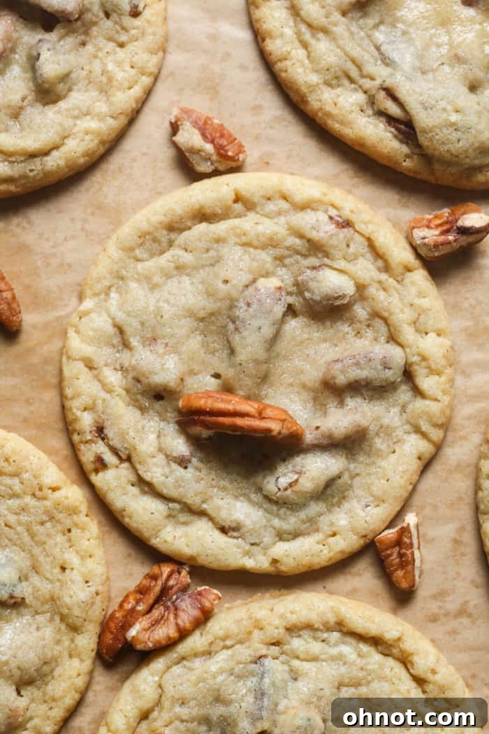Delicious homemade pecan cookies stacked on a plate.