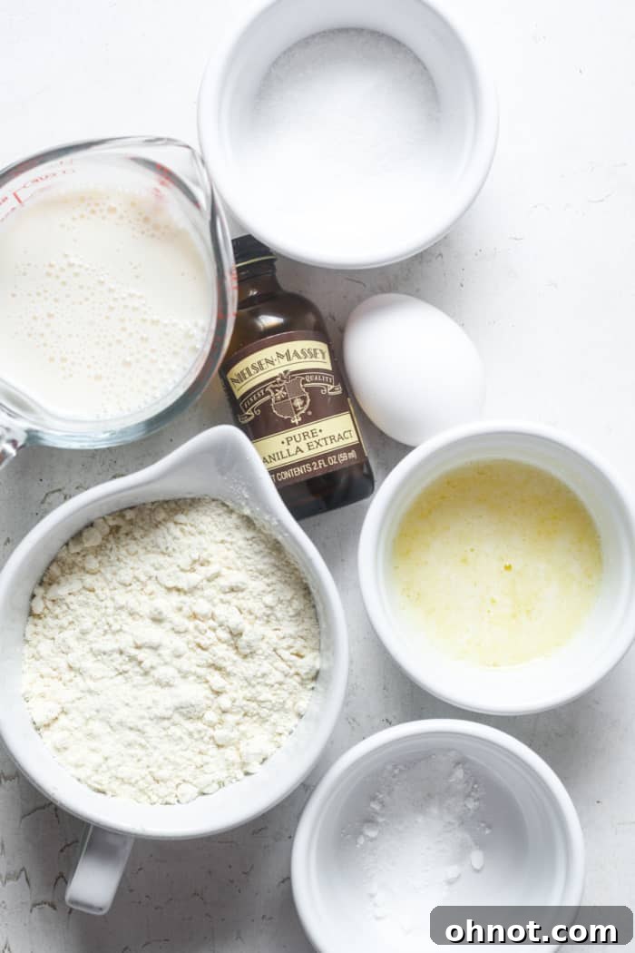 Key ingredients for making gluten-free waffles laid out on a surface.