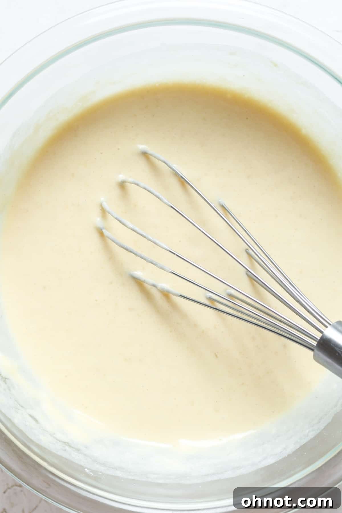 Smooth, well-mixed waffle batter in a bowl.