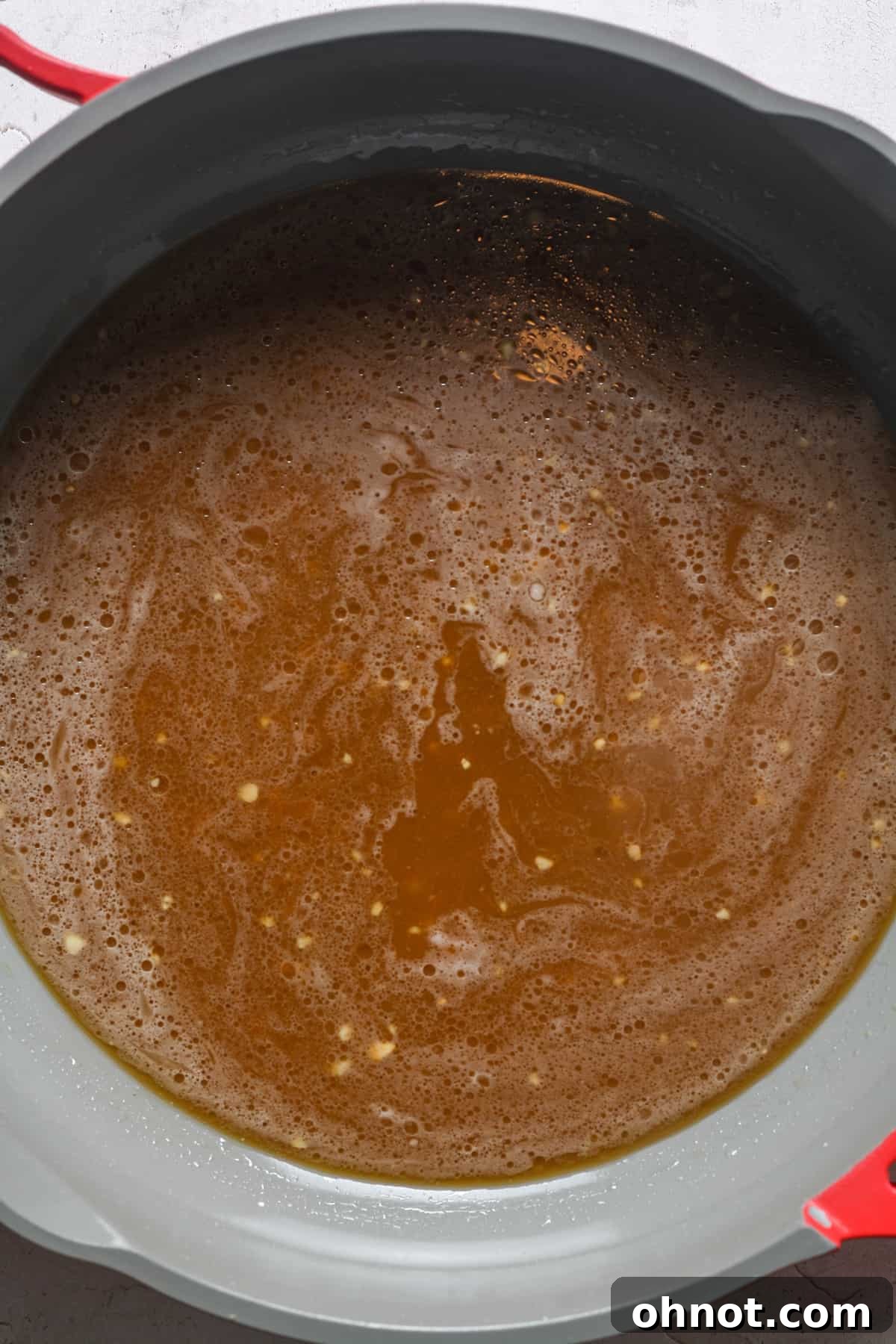 Creamy brown sauce in skillet.