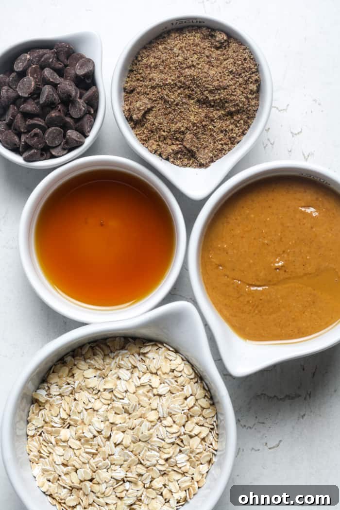 A selection of fresh, wholesome ingredients laid out on a surface for preparing peanut butter energy balls.