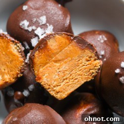Close-up of a healthy peanut butter ball with chocolate coating.