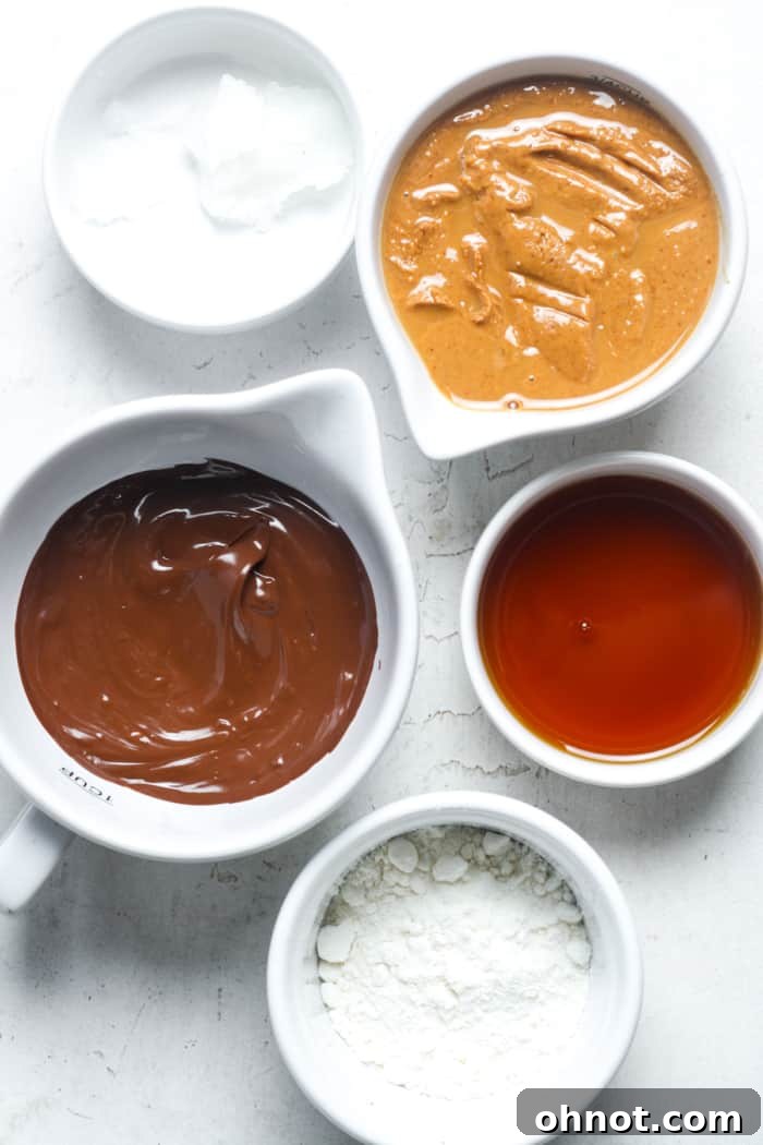 Ingredients for healthy peanut butter balls, laid out on a surface.