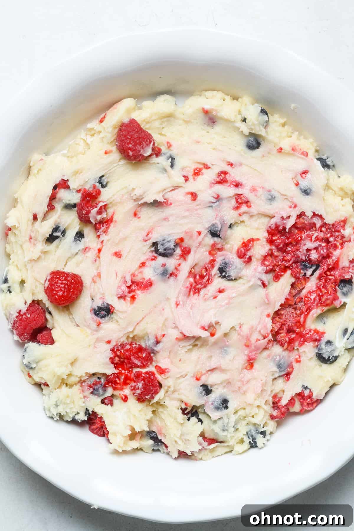 Raspberry batter in pie plate.