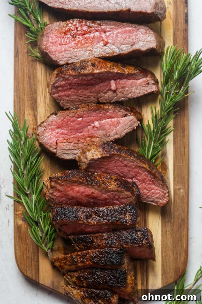 Sliced tri tip on wood.