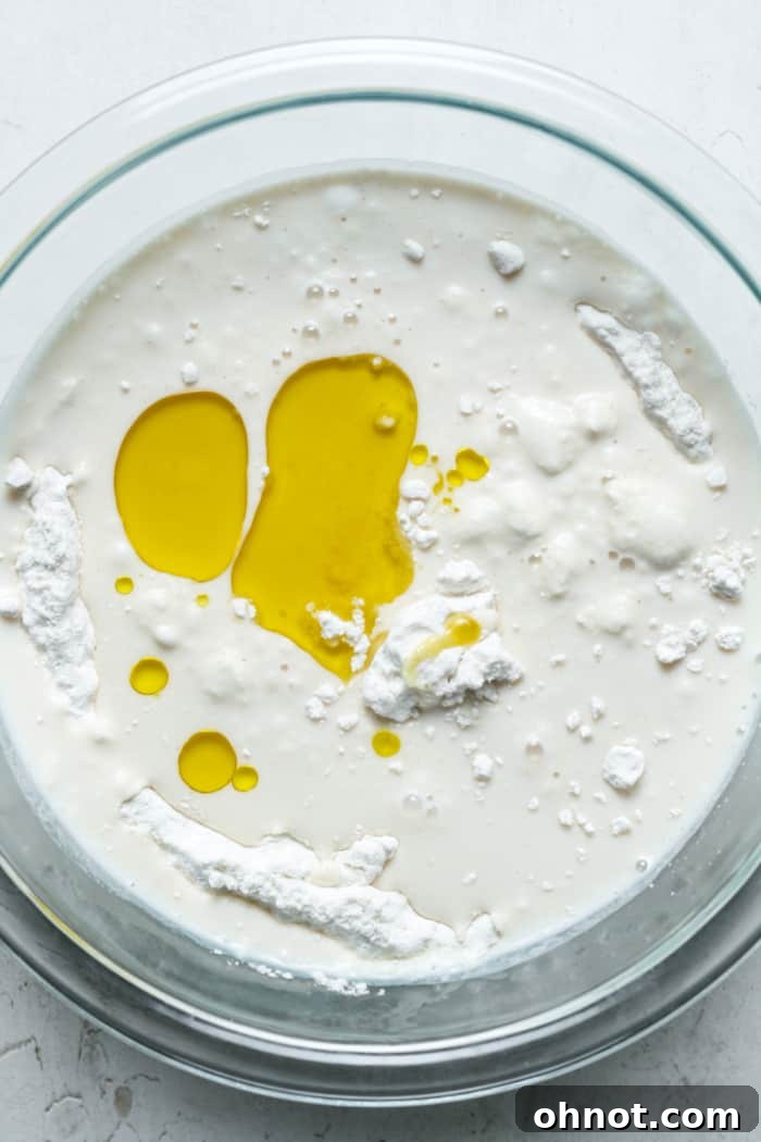 Oil, milk and dry ingredients in a bowl.