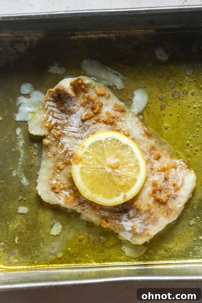 Baked cod in pan.