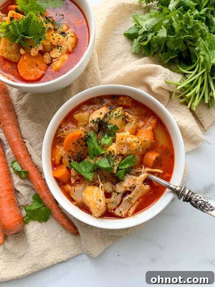 Hearty Whole30 Buffalo Chicken Soup with fresh herbs