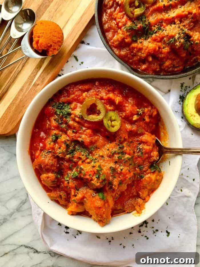 Hearty Whole30 Pumpkin Chili in a bowl with cilantro