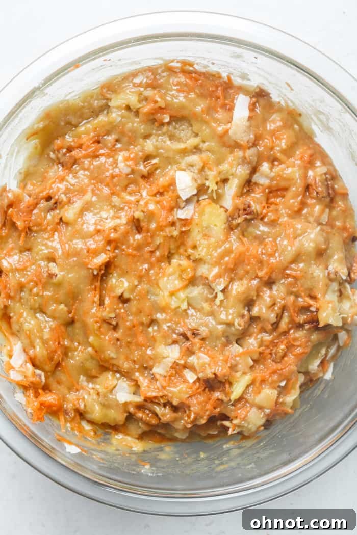 Carrot cake batter with added carrots, pineapple, and pecans.