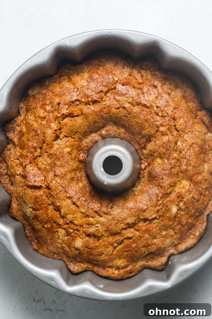 A freshly baked Bundt cake, golden brown.