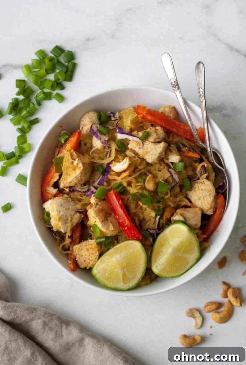 Plate of Whole30 Chicken Pad Thai garnished with cashews