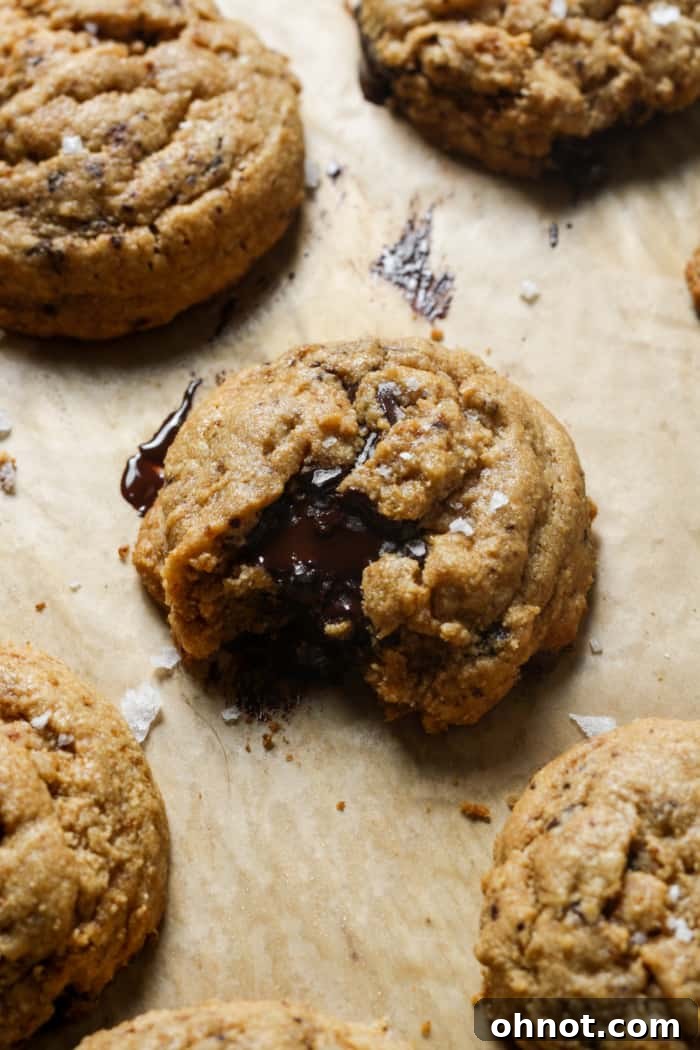 Close-up of a bite taken from a grain-free Paleo cookie, showing a gooey center.